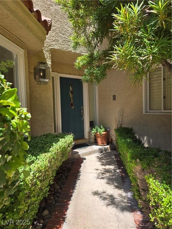5133 Southern Hills Ln, Las Vegas, NV 89113 - property entrance with stucco siding