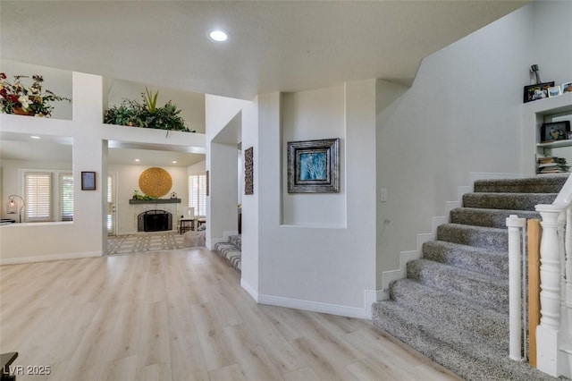5133 Southern Hills Ln, Las Vegas, NV 89113 - foyer with wood finished floors, stairs, healthy amount of natural light, recessed lighting, and a fireplace with raised hearth