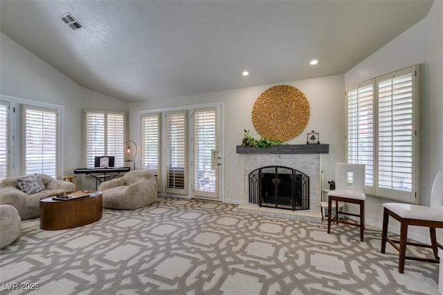 5133 Southern Hills Ln, Las Vegas, NV 89113 - carpeted living room featuring lofted ceiling, a stone fireplace, healthy amount of natural light, and recessed lighting