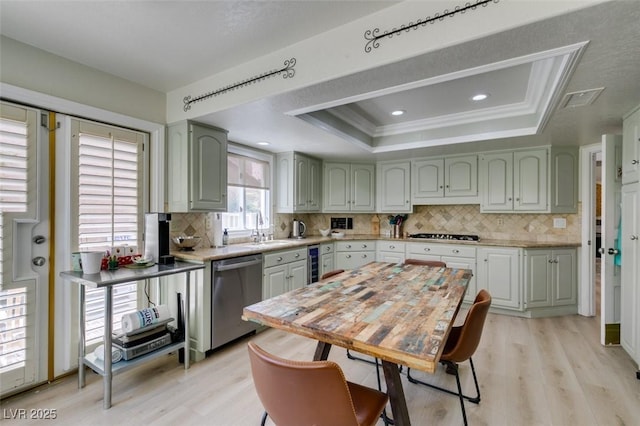 5133 Southern Hills Ln, Las Vegas, NV 89113 - kitchen with appliances with stainless steel finishes, beverage cooler, light wood-style floors, a raised ceiling, and backsplash