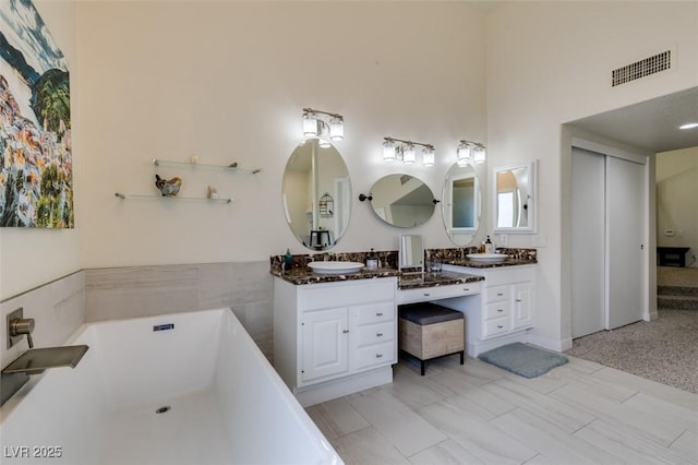 5133 Southern Hills Ln, Las Vegas, NV 89113 - bathroom featuring double vanity and a soaking tub