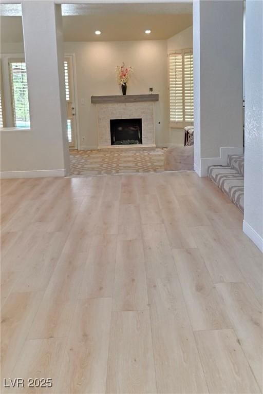 5133 Southern Hills Ln, Las Vegas, NV 89113 - unfurnished living room featuring wood finished floors, a fireplace, and recessed lighting