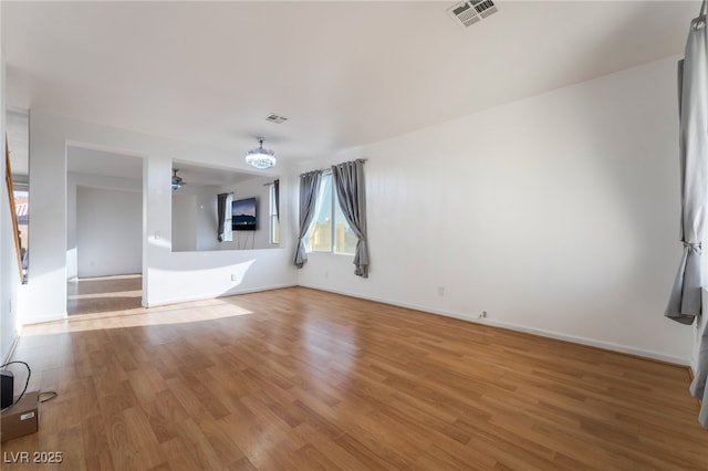 5907 Soft Mist Ct, Las Vegas, NV 89110 - unfurnished living room featuring light wood-style floors and a ceiling fan
