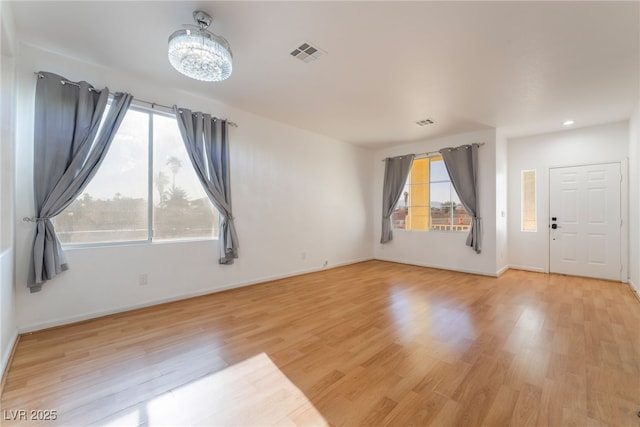 5907 Soft Mist Ct, Las Vegas, NV 89110 - empty room featuring wood finished floors, a chandelier, and recessed lighting