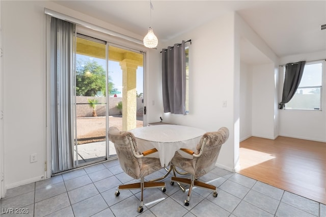 5907 Soft Mist Ct, Las Vegas, NV 89110 - dining space featuring plenty of natural light and light tile patterned floors