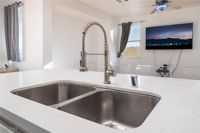 5907 Soft Mist Ct, Las Vegas, NV 89110 - detailed view of light stone counters and ceiling fan