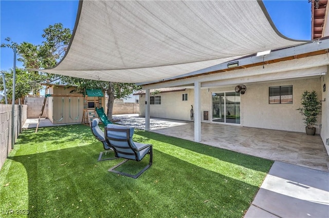 905 Smith St, Las Vegas, NV 89108 - fenced backyard with a playground and a patio