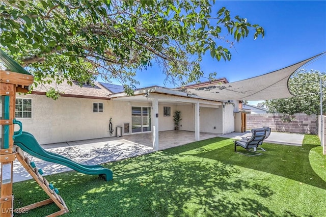 905 Smith St, Las Vegas, NV 89108 - rear view of property with stucco siding and a patio area