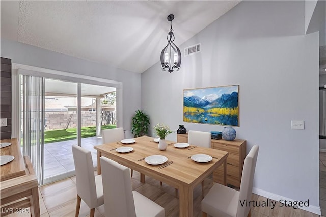 905 Smith St, Las Vegas, NV 89108 - dining room with lofted ceiling and a chandelier