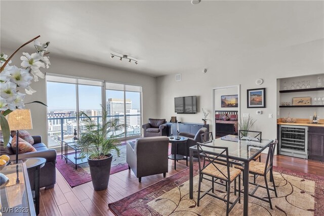 150 Las Vegas Blvd Unit 1906, Las Vegas, NV 89101 - dining space with wine cooler, a bar, and wood finished floors