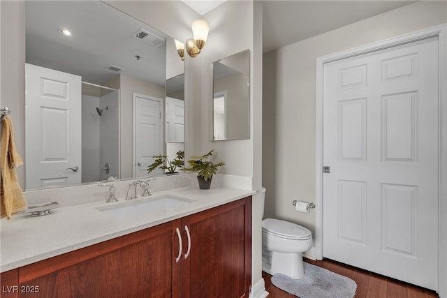 150 Las Vegas Blvd Unit 1906, Las Vegas, NV 89101 - bathroom with vanity, a shower, and wood finished floors