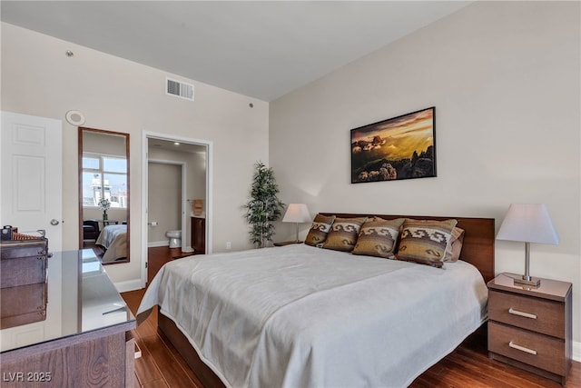 150 Las Vegas Blvd Unit 1906, Las Vegas, NV 89101 - bedroom featuring dark wood-style floors and ensuite bathroom