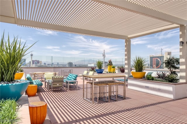 150 Las Vegas Blvd Unit 1906, Las Vegas, NV 89101 - view of patio with a pergola, a view of city, and outdoor dining space