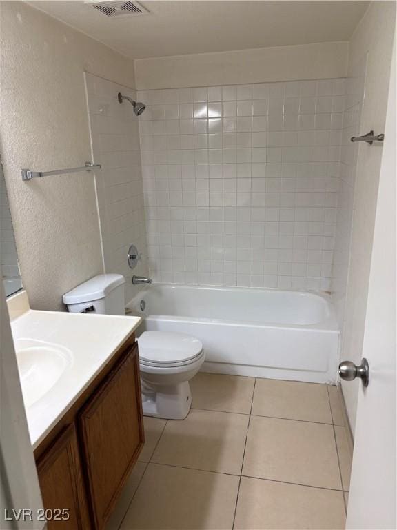 925 Falconhead Ln Unit 102, Las Vegas, NV 89128 - full bath featuring vanity, tile patterned flooring, shower / tub combination, and a textured wall