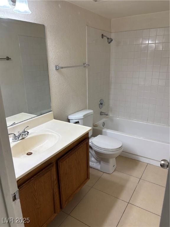 925 Falconhead Ln Unit 102, Las Vegas, NV 89128 - bathroom featuring a textured wall, vanity, shower / tub combination, and tile patterned floors