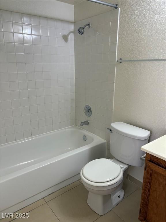 925 Falconhead Ln Unit 102, Las Vegas, NV 89128 - full bathroom with tile patterned flooring, vanity, and bathtub / shower combination