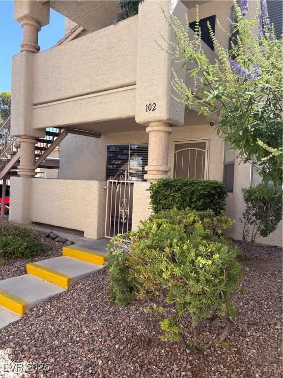 925 Falconhead Ln Unit 102, Las Vegas, NV 89128 - view of property featuring stairway