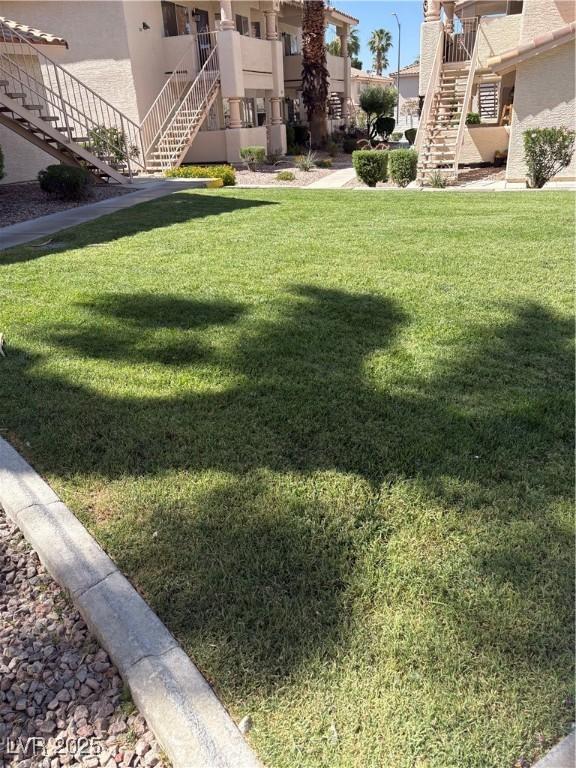 925 Falconhead Ln Unit 102, Las Vegas, NV 89128 - view of grassy yard with stairway