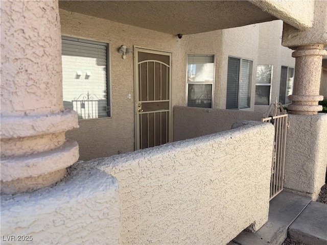 925 Falconhead Ln Unit 102, Las Vegas, NV 89128 - property entrance with stucco siding