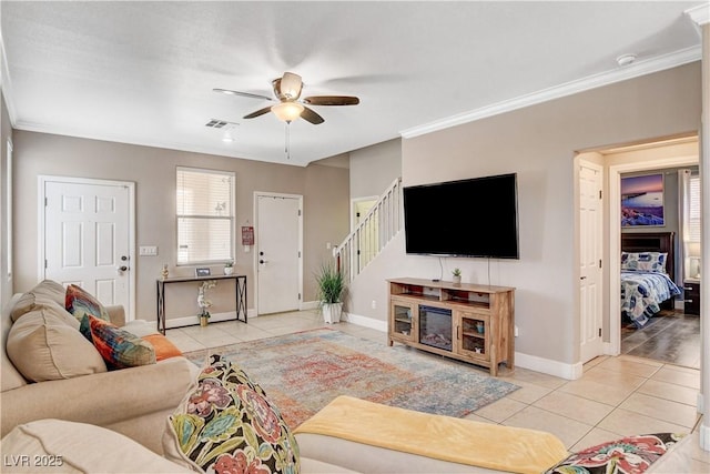 5516 Tantalum Ln, Las Vegas, NV 89122 - tiled living area featuring a ceiling fan, crown molding, and stairs