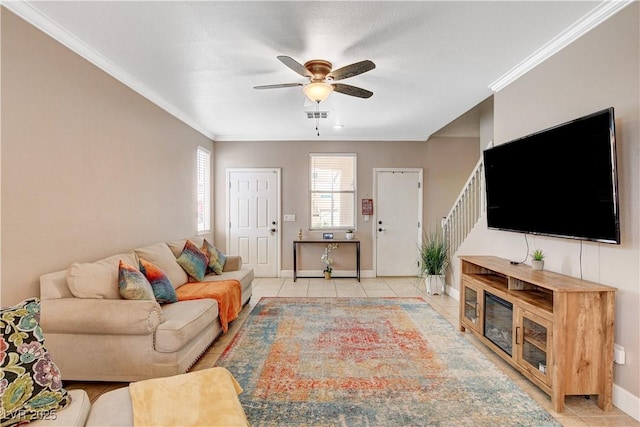 5516 Tantalum Ln, Las Vegas, NV 89122 - living room featuring a ceiling fan, ornamental molding, light tile patterned floors, and stairway