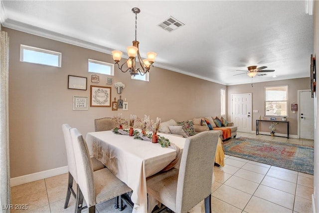 5516 Tantalum Ln, Las Vegas, NV 89122 - dining area featuring light tile patterned floors, a chandelier, ornamental molding, and a ceiling fan