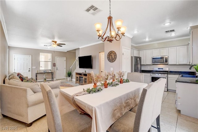 5516 Tantalum Ln, Las Vegas, NV 89122 - dining room featuring light tile patterned floors, a ceiling fan, a chandelier, and crown molding