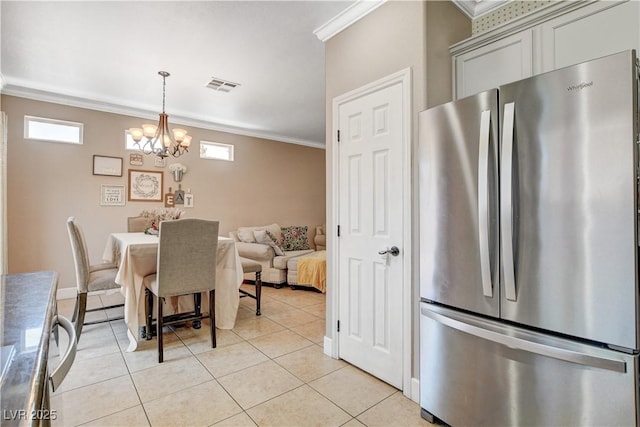 5516 Tantalum Ln, Las Vegas, NV 89122 - dining space featuring ornamental molding, a chandelier, and light tile patterned flooring