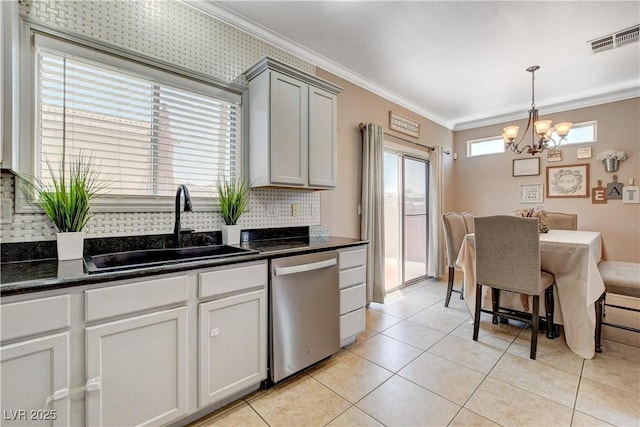 5516 Tantalum Ln, Las Vegas, NV 89122 - kitchen with stainless steel dishwasher, backsplash, a chandelier, ornamental molding, and light tile patterned floors