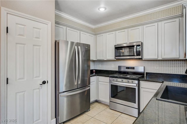 5516 Tantalum Ln, Las Vegas, NV 89122 - kitchen with stainless steel appliances, crown molding, light tile patterned flooring, and backsplash
