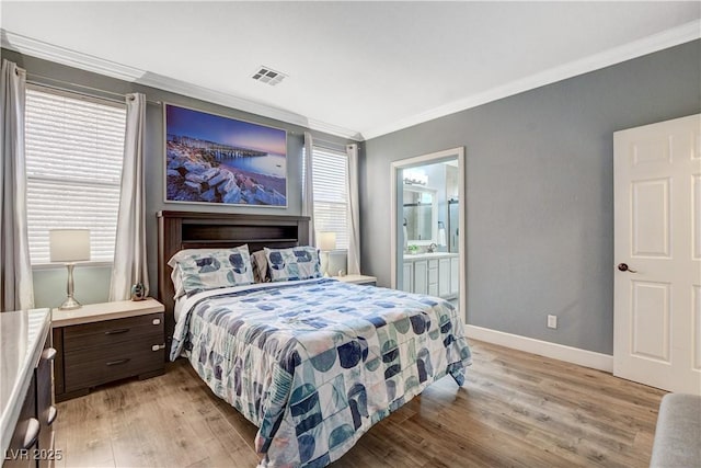 5516 Tantalum Ln, Las Vegas, NV 89122 - bedroom with ornamental molding, light wood finished floors, multiple windows, and ensuite bath