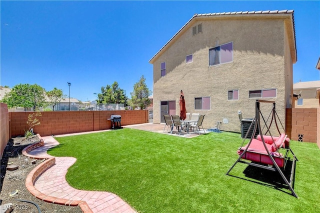 5516 Tantalum Ln, Las Vegas, NV 89122 - back of property featuring stucco siding, a fenced backyard, and a patio