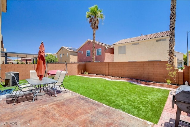 5516 Tantalum Ln, Las Vegas, NV 89122 - fenced backyard with a patio area and outdoor dining area