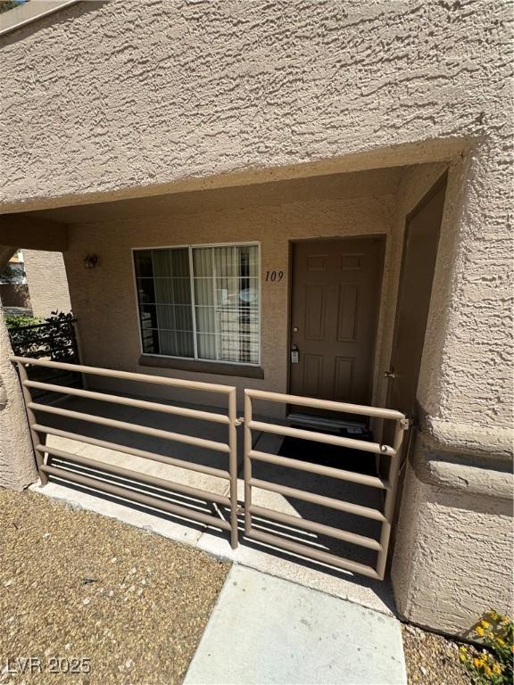 9070 Spring Mountain Rd Unit 109, Las Vegas, NV 89117 - view of exterior entry featuring stucco siding