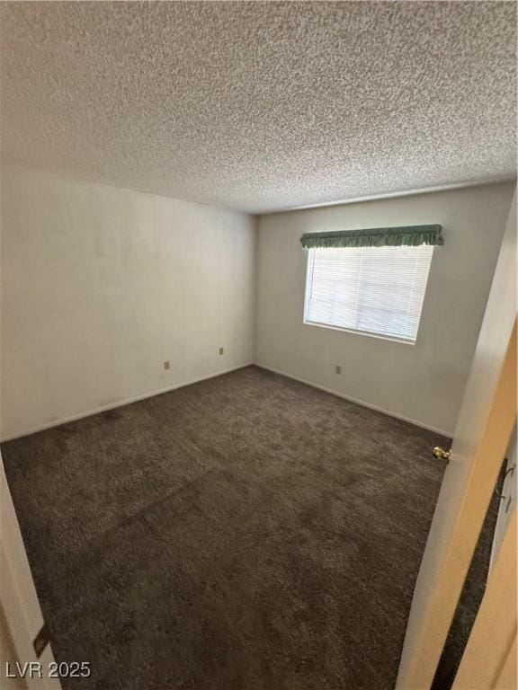 9070 Spring Mountain Rd Unit 109, Las Vegas, NV 89117 - carpeted empty room with a textured ceiling