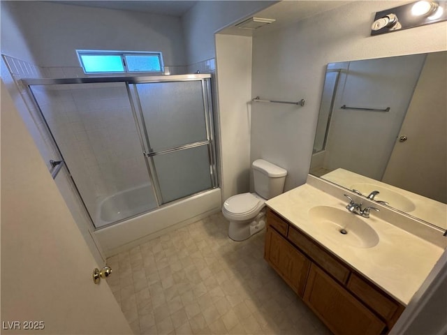 9070 Spring Mountain Rd Unit 109, Las Vegas, NV 89117 - bathroom with vanity, combined bath / shower with glass door, and tile patterned floors