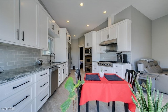 3708 Lorraine Ln, Las Vegas, NV 89120 - kitchen featuring stainless steel appliances, under cabinet range hood, white cabinetry, light stone counters, and recessed lighting