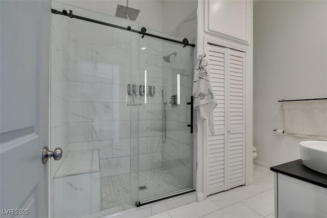 3708 Lorraine Ln, Las Vegas, NV 89120 - bathroom featuring a stall shower, vanity, and a closet