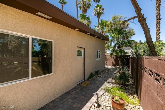 3708 Lorraine Ln, Las Vegas, NV 89120 - view of side of property with stucco siding, a fenced backyard, and a patio