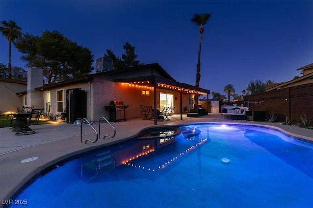3708 Lorraine Ln, Las Vegas, NV 89120 - pool at twilight featuring a patio, a fenced backyard, and a jacuzzi