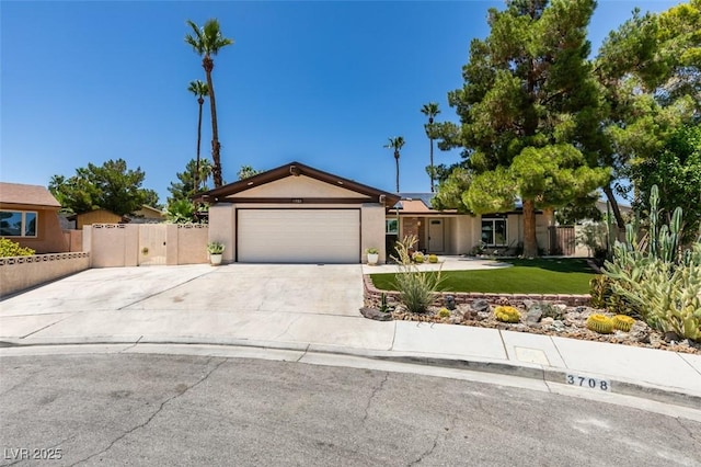 3708 Lorraine Ln, Las Vegas, NV 89120 - ranch-style house featuring stucco siding, driveway, a garage, and a gate