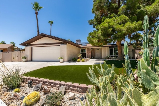 3708 Lorraine Ln, Las Vegas, NV 89120 - ranch-style home featuring driveway, solar panels, stucco siding, and a garage