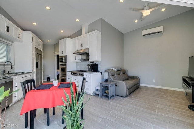 3708 Lorraine Ln, Las Vegas, NV 89120 - dining space featuring a wall mounted AC, ceiling fan, recessed lighting, light wood-type flooring, and vaulted ceiling