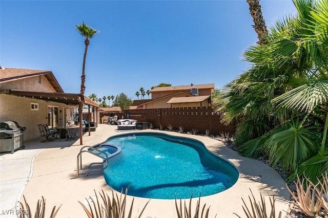 3708 Lorraine Ln, Las Vegas, NV 89120 - view of pool with a fenced backyard, a patio, grilling area, a pool with connected hot tub, and an outdoor hangout area