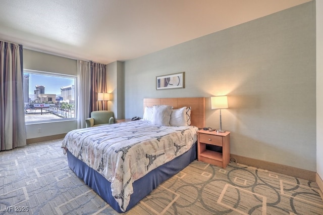 211 E Flamingo Rd Unit 402, Las Vegas, NV 89169 - bedroom featuring baseboards and carpet