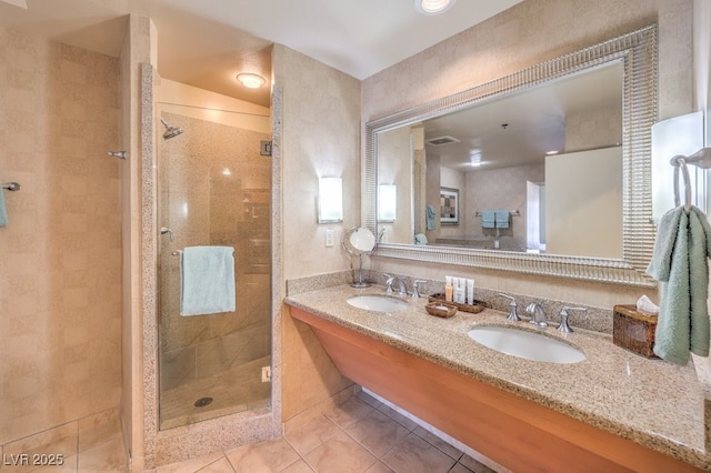 211 E Flamingo Rd Unit 402, Las Vegas, NV 89169 - full bathroom with tile patterned flooring, a shower stall, and double vanity