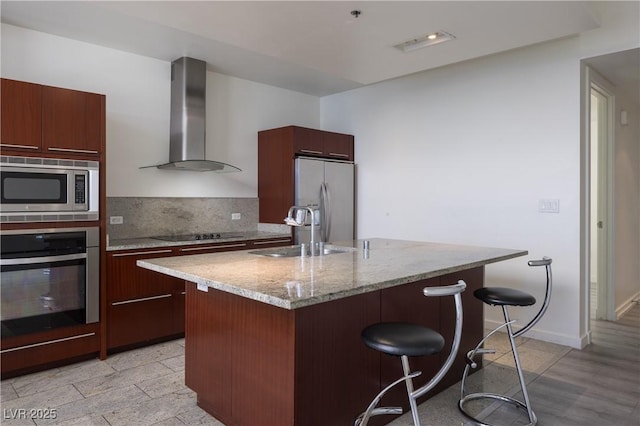 4471 Dean Martin Dr Unit 2406, Las Vegas, NV 89103 - kitchen featuring appliances with stainless steel finishes, wall chimney exhaust hood, a kitchen bar, and modern cabinets