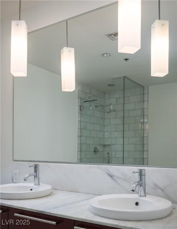 4471 Dean Martin Dr Unit 2406, Las Vegas, NV 89103 - bathroom with double vanity and a shower stall