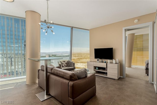 3722 Las Vegas Blvd Unit 3209, Las Vegas, NV 89158 - living room with a chandelier, expansive windows, and dark tile patterned flooring