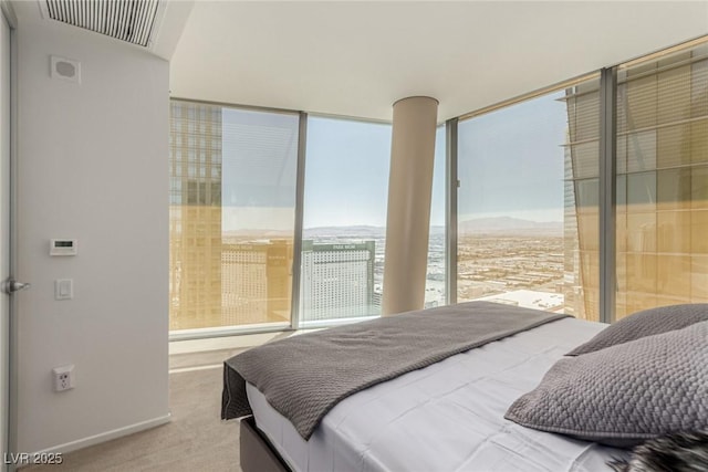 3722 Las Vegas Blvd Unit 3209, Las Vegas, NV 89158 - bedroom with expansive windows, carpet flooring, and a mountain view